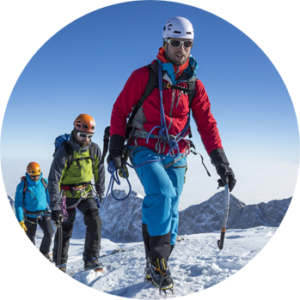 Group of men climbing an icy mountain