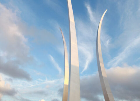 United States Air Force Memorial three spires soaring into a partly cloudy blue sky