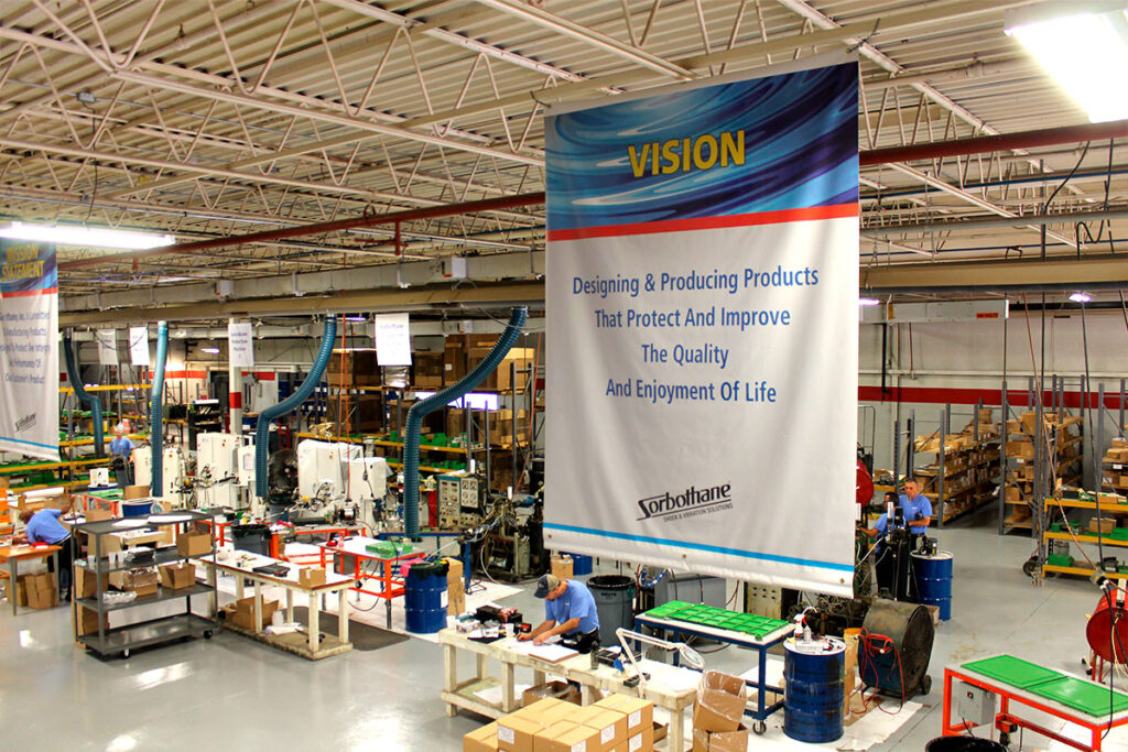 Sorbothane warehouse with vision statement banner