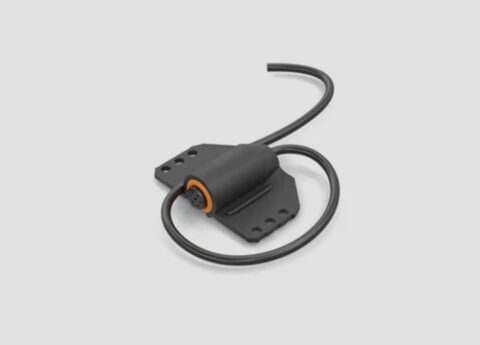 Lavalier microphone with a sound-absorbing material wrapped around the mic for added noise control.