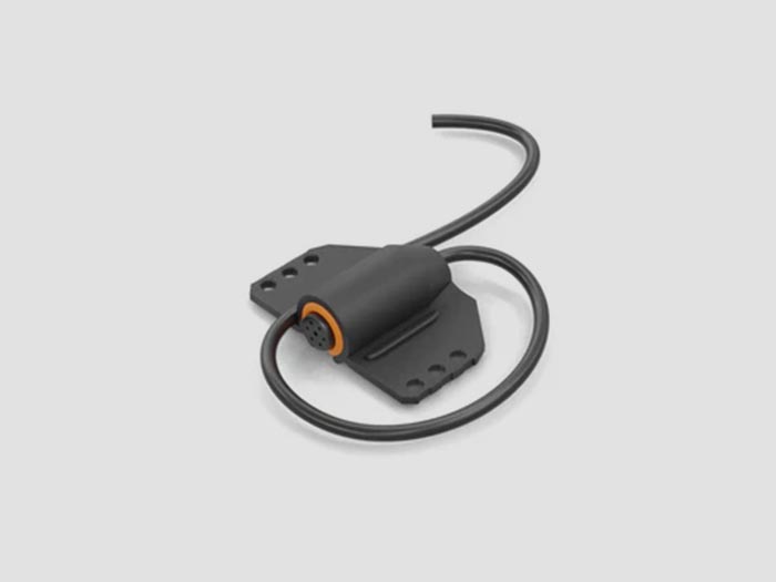 Lavalier microphone with a sound-absorbing material wrapped around the mic for added noise control.